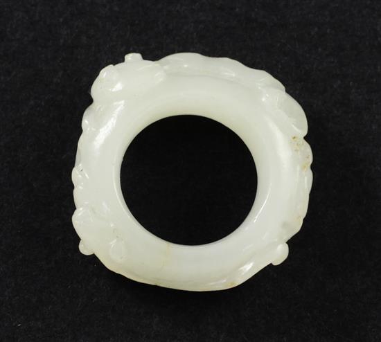 A Chinese white jade archers thumb ring, 18th / 19th century, 3cm